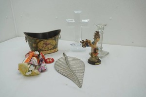 assortment of home decor items, glass cross and candle stick holder, metal leaf and more