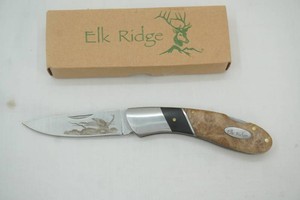 Elk Ridge hunting knife with etched design, pocket knife