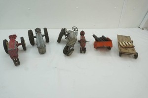 group of vintage broken toy tractors