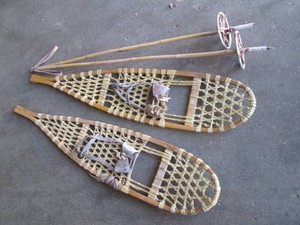 Pair of rawhide snowshoes with poles