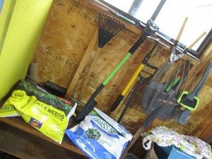 Wood shelf, lawn products, gardening tools, snow brushes and other misc