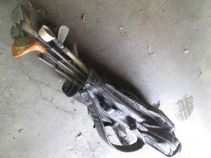 Vintage golf bag with clubs and drivers