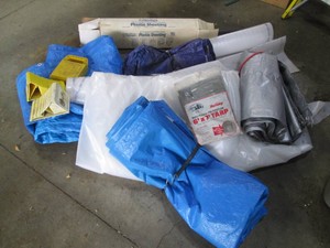 Bundle of tarps and plastic sheeting in various sizes plus wheel chocks