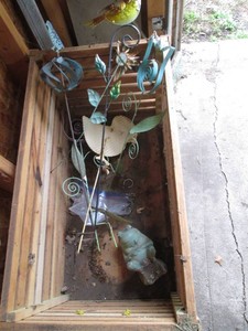 Wood storage crate with misc lawn decor