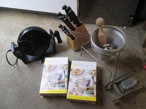 Knife block with cutlery, waffle iron and other kitchen supplies