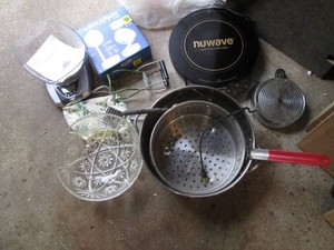 Countertop hot plate, steamer pot, kitchen scale and other kitchen supplies shown