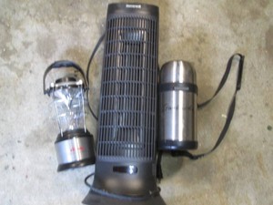 Oscillating tower fan, Starbucks travel thermos and battery powered lantern