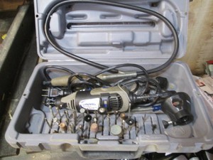 Dremel tool in case with misc supplies