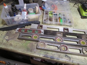 Variety of construction levels, misc tape, glue and more