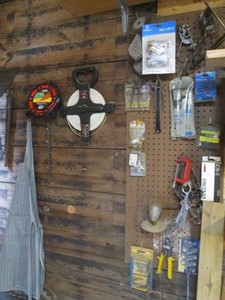 Misc tools and hardware on shop wall