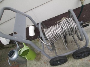 Metal hose reel cart with unknown length hose