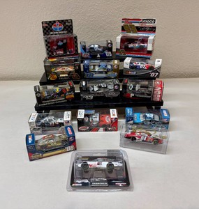Assortment of NASCAR 164 Scale Collectible Cars In Original Boxes