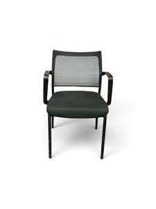 black mesh-back guestconference chair with fixed armrests and a padded fabric seat