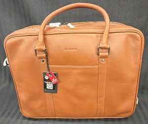 New - This is a tan leather briefcase-style laptop bag from Champs, with the brand name embossed on the front.