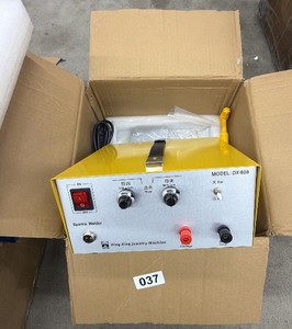 New - This is a Ding Xing DX-808 jewelry spot welder (labeled Sparkle Welder), a small pulse-arc welder used by jewelers to weld, repair, and join fine metal pieces like gold, silver, and platinum without heating the whole item.