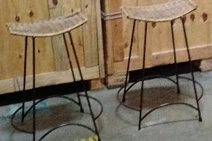 two wicker bar stools