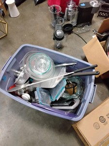 tote of glass bowls and kitchen supplies