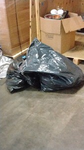 trash bag of pots and pans
