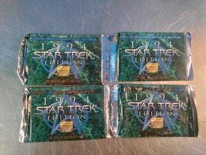 Four sealed foil packs of 1994 SkyBox Star Trek Master Series (Series 2) trading cards