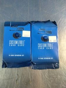 Two factory-sealed 1995 Star Trek The Next Generation Customizable Card Game (CCG) 15-card booster packs made by Decipher