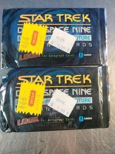 Two unopened foil packs of Star Trek Deep Space Nine trading cards from 1999, labeled Memories from the Future by SkyBox
