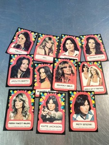 Vintage 1977 Topps Charlies Angels trading card stickers featuring portraits of the shows cast members.
