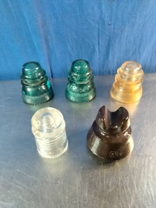 Five vintage electrical line and telegraph pole insulators
