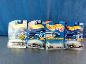 Four packaged die-cast toy cars from the Hot Wheels by Mattel.