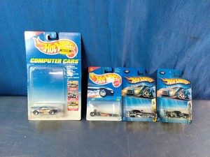 Group of packaged 1990s and 2000s Mattel Hot Wheels die-cast toy cars
