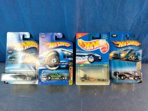 Four sealed Hot Wheels die-cast cars from the early 2000s,