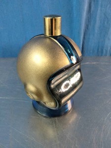 A vintage Avon Opening Play Football Helmet decanter bottle, often filled with Wild Country aftershave or Spicy cologne from the 1970s