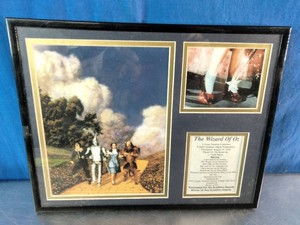 This piece is The Wizard of Oz Yellow Brick Road Framed Memorabilia by the brand Legends Never Die
