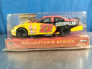 Racing Champions 124 scale die-cast replica of Ward Burtons #22 Caterpillar Dodge NASCAR