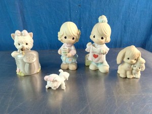 A collection of Precious Moments porcelain bisque figurines
