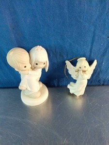 Collectible porcelain pieces from the Precious Moments collection,