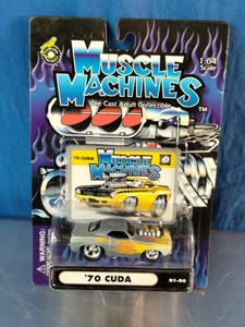 164 scale Muscle Machines 70 Cuda die-cast collectible toy car in a factory-sealed blister pack with silver-and-orange flame graphics