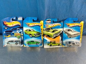 Four packaged Hot Wheels muscle car die-cast models