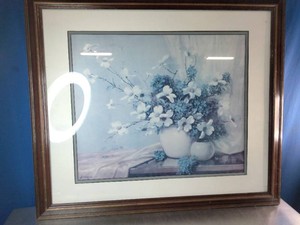 A floral still life featuring white dogwood blossoms and blue hydrangeas by artist A. D. Greer