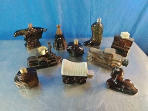 A collection of vintage Avon novelty cologne and aftershave decanters from the 1970s,