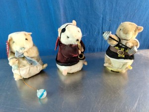 A set of vintage Gemmy Dancing Hamsters plush toys from the early 2000s