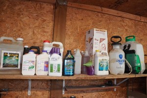 Assorted Lawn Care Chemicals and Sprayers