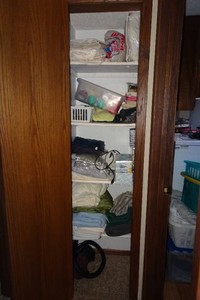 Contents of Closet - Fabric, Iron, Clothing, Boxes of Kleenex, Bedding