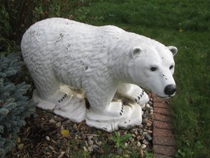 Extremely heavy Cement Polar bear Lawn Ornament decor approx 40in from nose to rump and 24in tall. Buyer responsible to bring any physical assistance as well as the proper equipment and vehicle to haul from the property