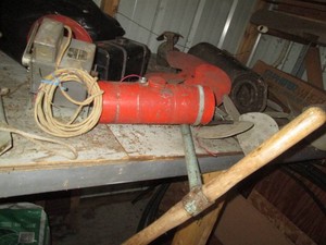 Post hole digger with Variety of vintage metal propellers, gas tanks and other materials shown in pics