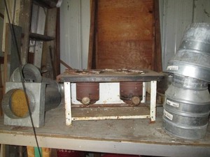 Antique Oil powered Cooking stove, metal vent tubing supplies and other supplies shown