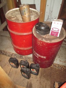 Metal Oil and National Carbide nut cans, Citgo 10W-40 motor oil and misc supplies shown