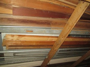 All materials in rafters of Shed to include metal pipes, PVC, assorted lumber and Styrofoam insulation