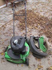 Lawn-Bot gas powered self propelled push mower with bagger and misc attachments