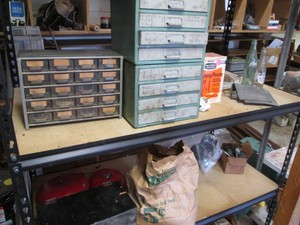 Variety of organizers with content plus vintage glass soda bottles and other misc shown