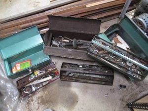 Vintage metal toolbox trio containing vintage hand tools, hardware and misc supplies shown